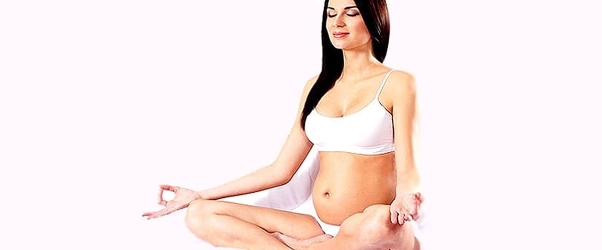 article about argan oil for stretch marks Image pregnant woman sitting