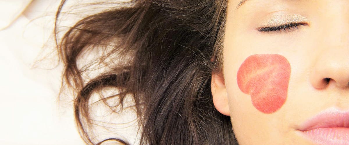 article about hot oil hair mask treatment picture of woman hair with argan oil