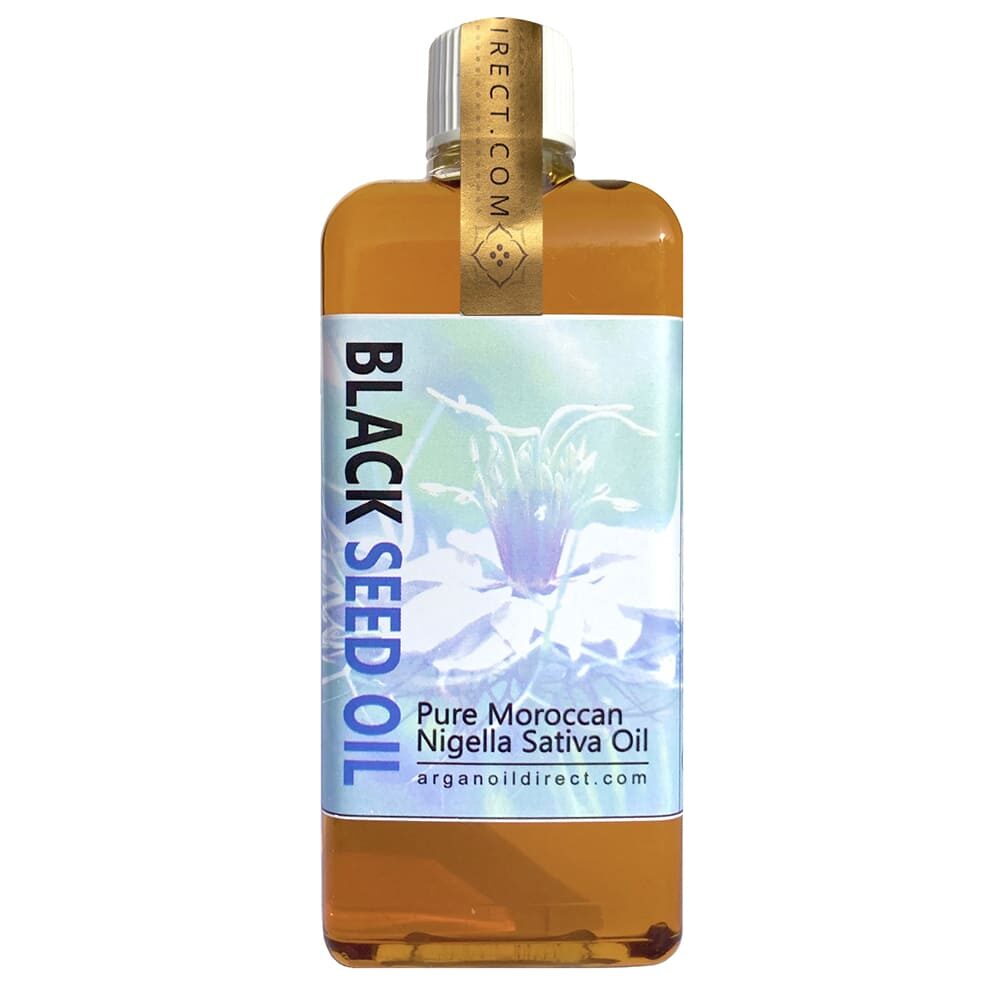 A product shot of a bottle containing pure, cold-pressed black seed oil, labeled as Nigella Sativa Oil. The bottle is sealed and ready for use.