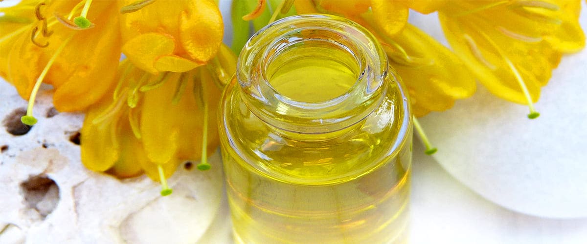 overhead view into clear 10ml bottle of yellow oil
